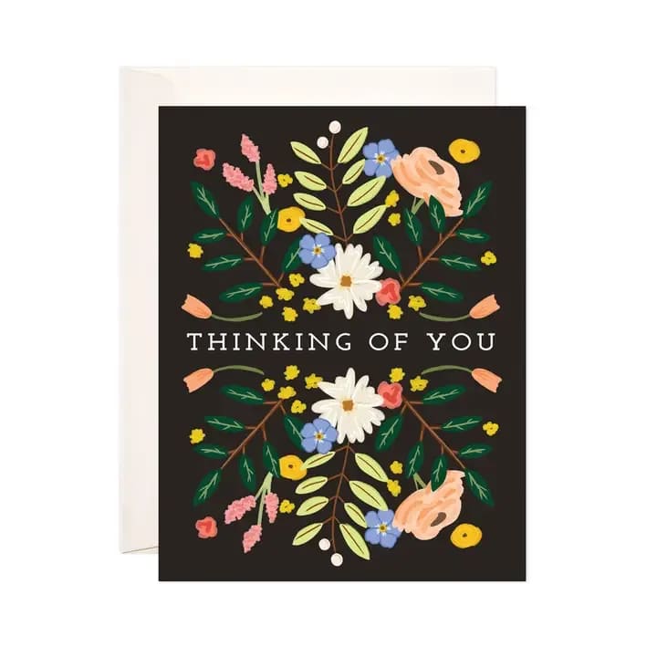 Thinking of You card with floral illustration on a black background