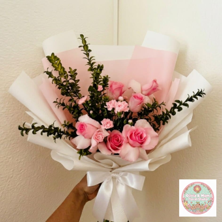 Pink Mochi - Sweet, chic, and pillowy—Pink Mochi is a modern take on romance. The combination of premium pink roses and ruffled mini carnations creates a soft, rounded silhouette that feels as sweet as a celebration.  This seasonal bouquet features:  Light Pink Roses  Light Pink Mini Carnations  Fresh Boxwood  Garden Greens  Presentation: Expertly wrapped in our signature textured paper and tied with satin ribbon. Prefer a vase? Add one to your cart to complete the look.  Personal Touch: We’ll include a custom card message with every order. You’ll be able to write your message at checkout.  Please Note: All flowers are subject to seasonal availability. If a specific bloom isn’t available, our designers will thoughtfully substitute with flowers in a similar shape, style, and color.  Standard size shown. Vase upgrade is optional.   Floral Care Guide  Your arrangement arrives in our signature "double wrap" and is nestled in a protective box. While the stems are secured with a wet wrap for transit they are ready for a full drink!   Unpack: Gently lift the bouquet from the box. Remove the plastic bag and wet towel from the stems. Trim &amp; Hydrate: Trim 1/2" off stems at an angle and place in a clean vase with cool water. Refreshed: Change water daily for a long-lasting bloom.