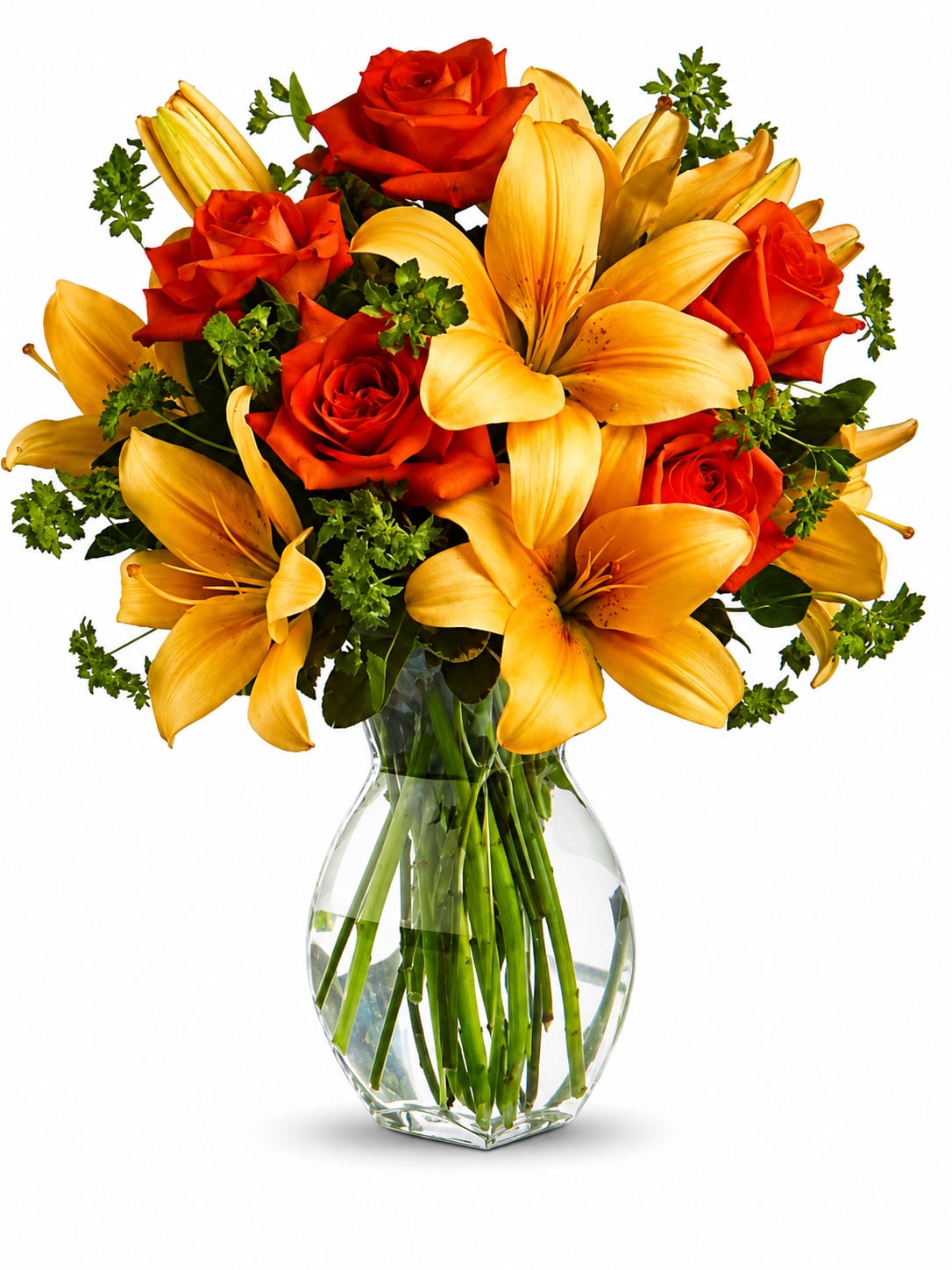 Orange roses and yellow lilies in a clear glass vase