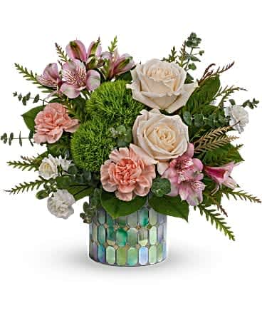 Storybook Garden Bouquet (only pink mosaic available at this time) - Wild and whimsical, this enchanting bouquet of crÃ¨me roses and peachy blooms looks storybook sweet in a keepsake container of mosaic stained glass. This unique bouquet features crÃ¨me roses, peach carnations, miniature white carnations, light pink alstroemeria, green trick dianthus, spiral eucalyptus, lemon leaf and grevillea. Delivered in a Marvelous Mosaic Cylinder.