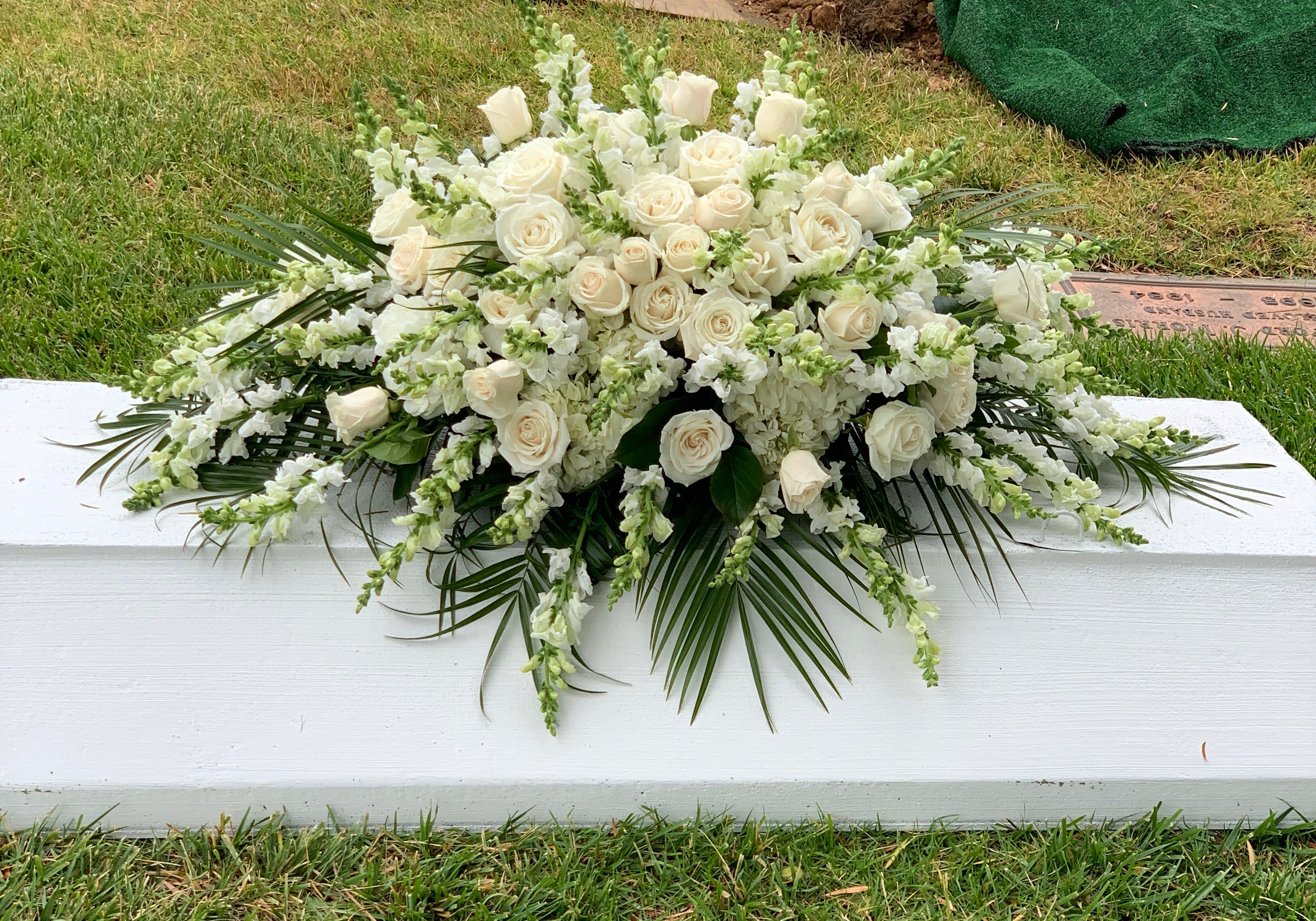 Elegant White Casket - All white Casket , includes, roses, hydrangea, snapdragons, and greenery 