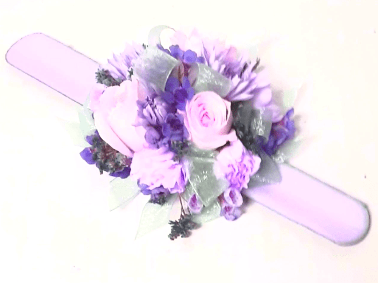 Lavender and pink floral wrist corsage with ribbon band