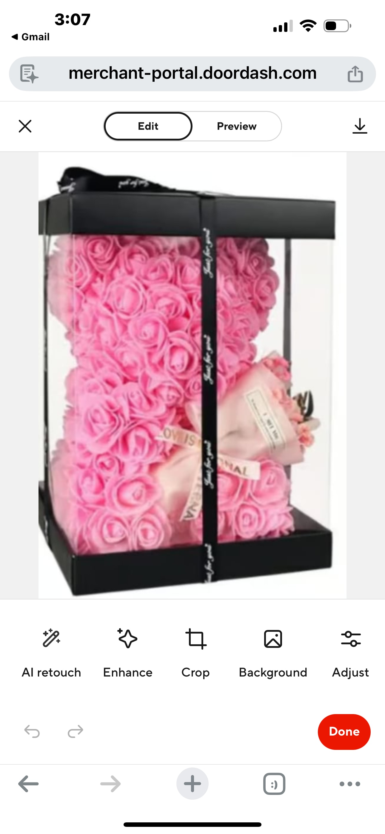 Pink rose teddy bear in a black gift box with a ribbon