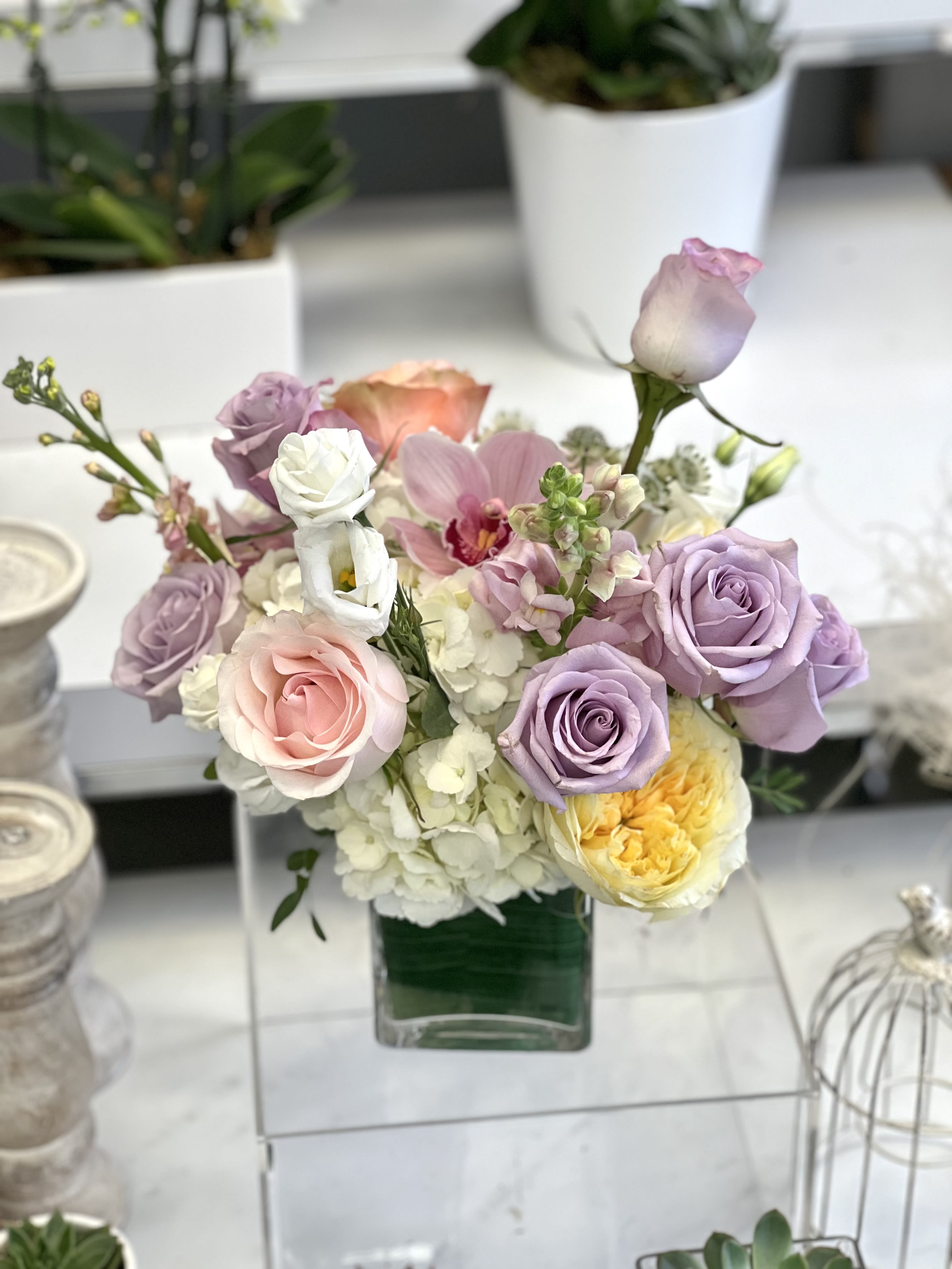 Coming Home  - A selection of pink and purple flowers come together in an eye-pleasing arrangement. This arrangement makes a great gift for Mother's Day, Women's Day, or as a thinking of you present.  