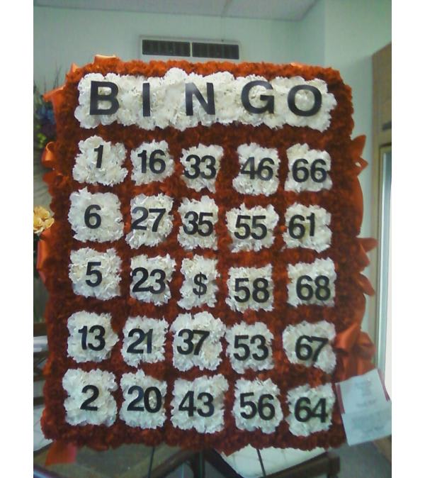 Floral bingo board with white flower squares and black numbers on an orange-red background