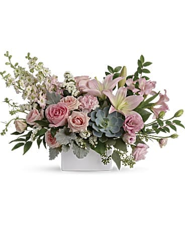 Pink roses and lilies in a white rectangular vase