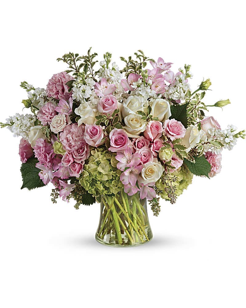 Pink and white mixed bouquet in a clear glass vase