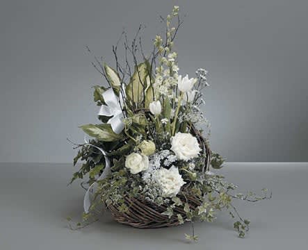 SF15-21 - John Henry Sympathy - A nice mix of garden plants placed in a wicker basket. With accents of a array of white flowers &amp; plants placed through out the garden.