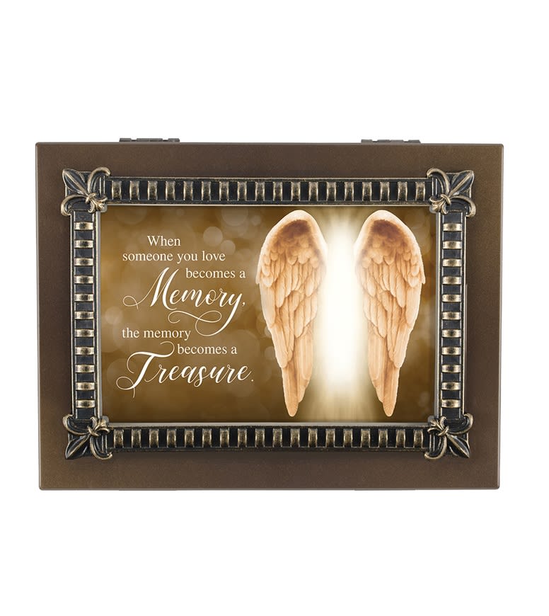 Decorative memorial plaque with angel wings and a sympathy quote