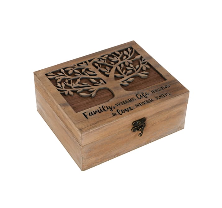 Wooden keepsake box with a carved tree lid and engraved text