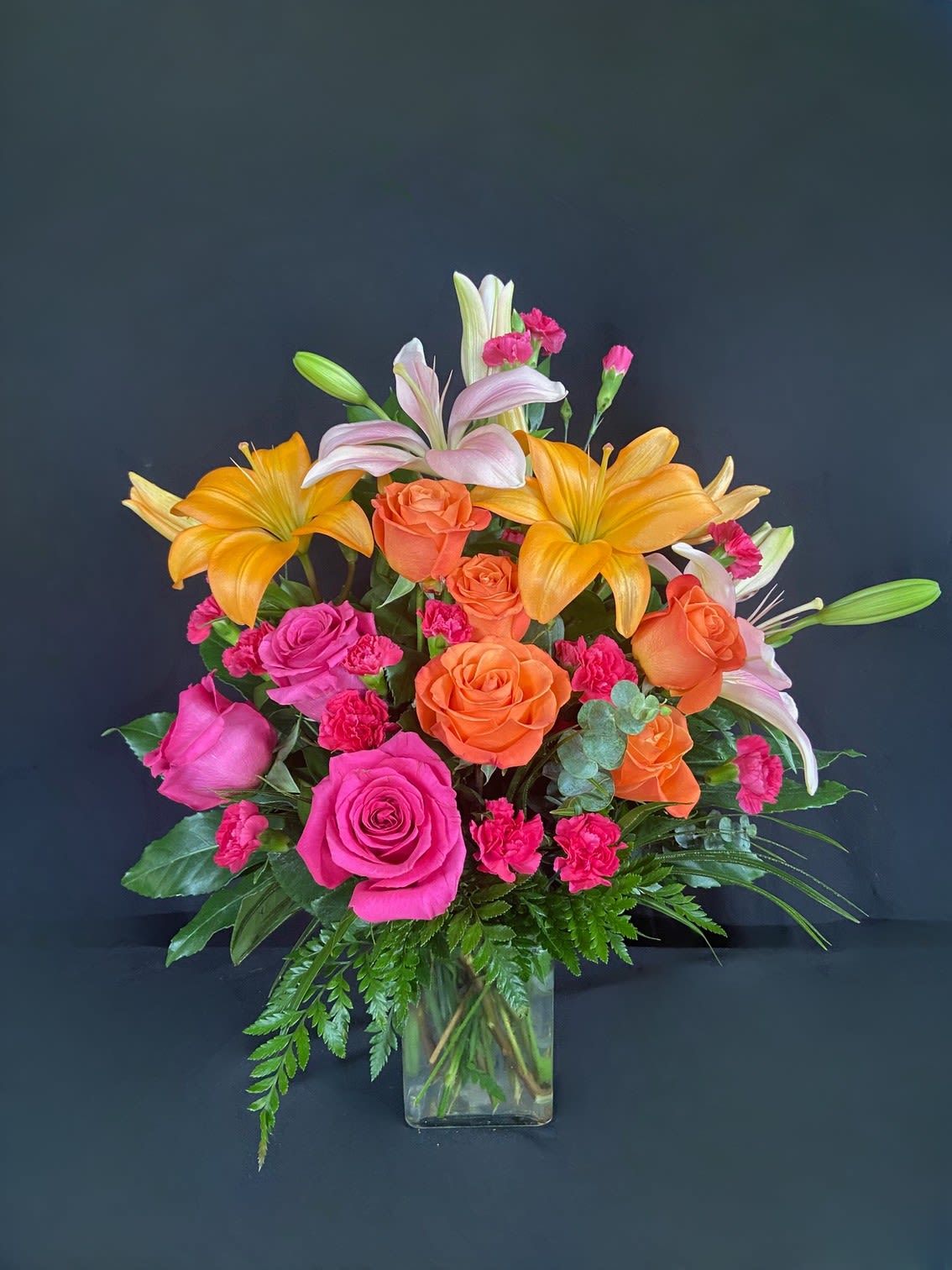 Boss Babe  - This arrangement is electric! Send this bright orange and hot pink rose arrangement to make a big impression. 