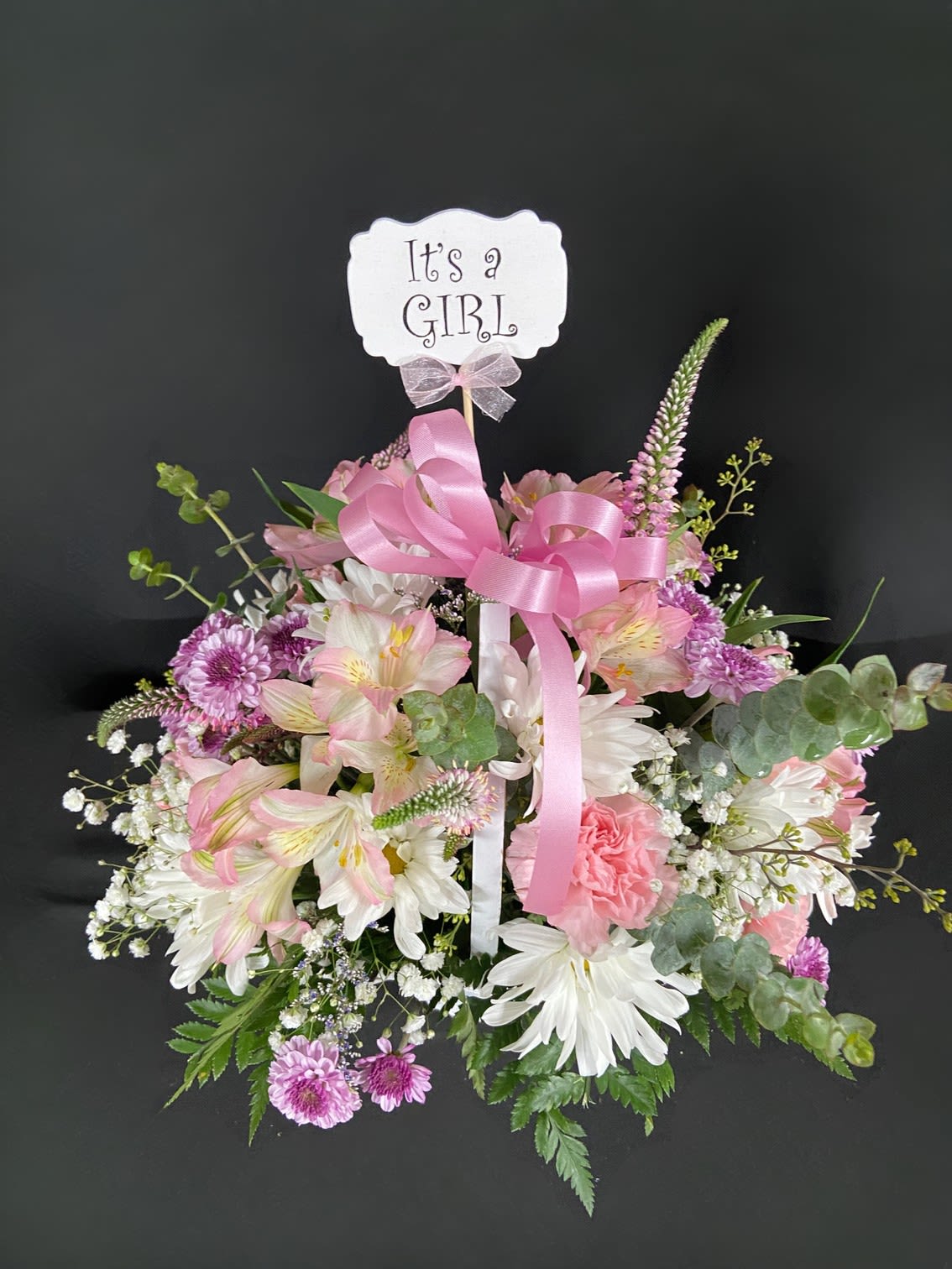 Pink Princess - A princess has been born! Welcome her into the world with a basket of beauty. This princess basket is filled with carnations, alstroemeria, and veronica.