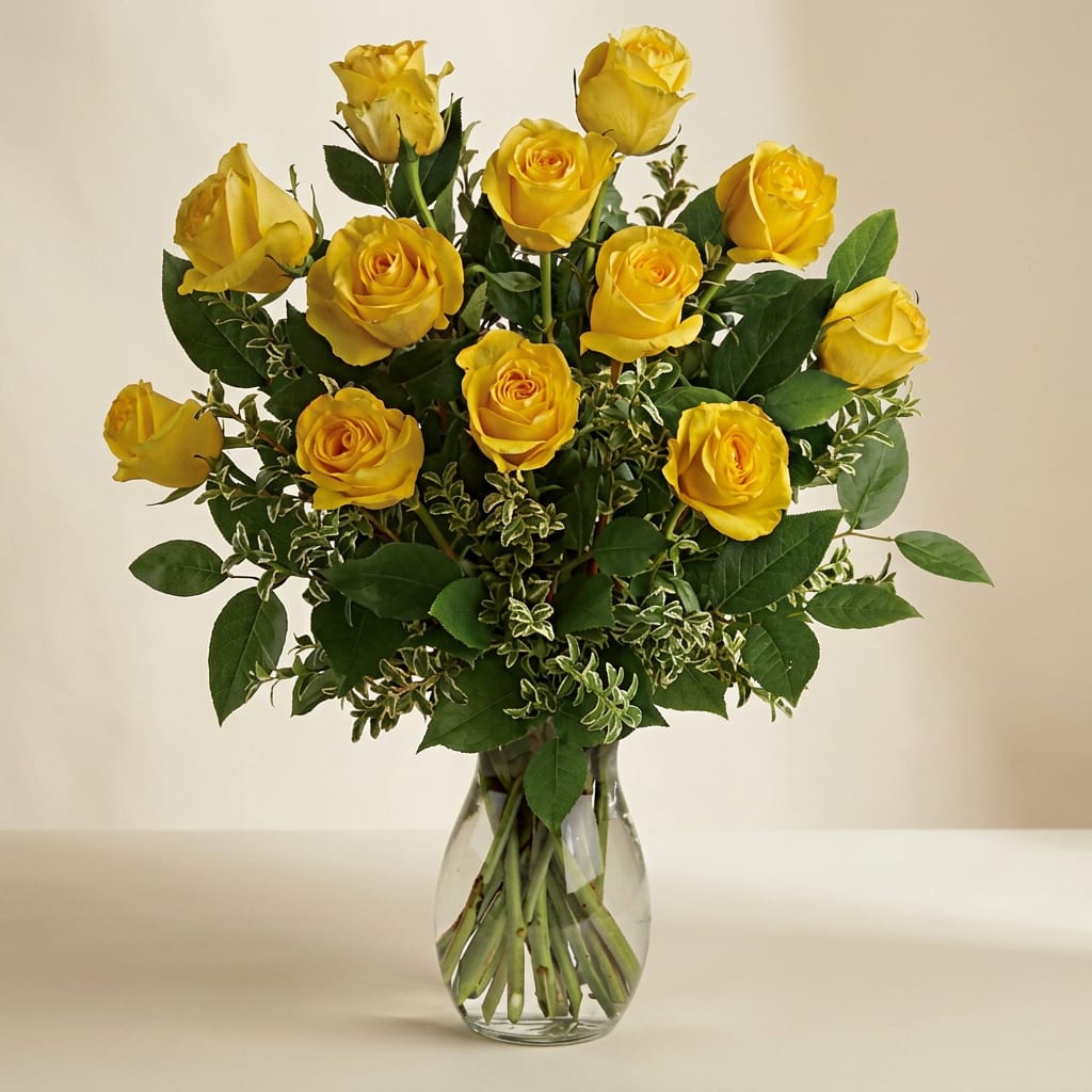 Yellow roses arranged in a clear glass vase