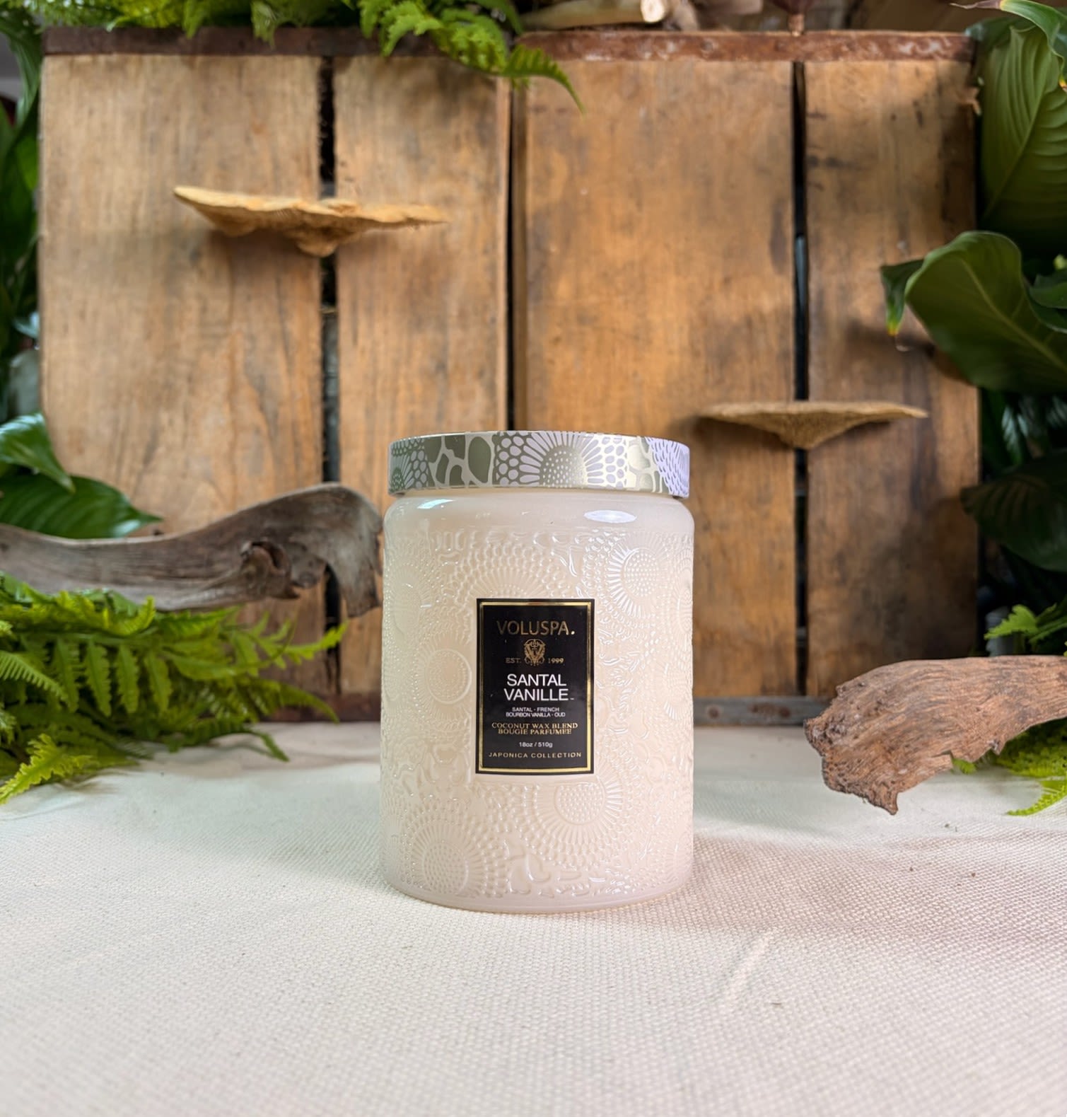 Voluspa Santal Vanille Large Glass Jar Candle 18 oz - Voluspa Santal Vanille Large Glass Jar Candle 18 oz  Fragrance Notes: A veil of intoxicating vanilla, exotic oud and warmest sandalwood mingle in a sensually smooth, creamy brulée, casting a quiet glow from lust-worthy, pearlescent glass as captivating as the fragrance. 