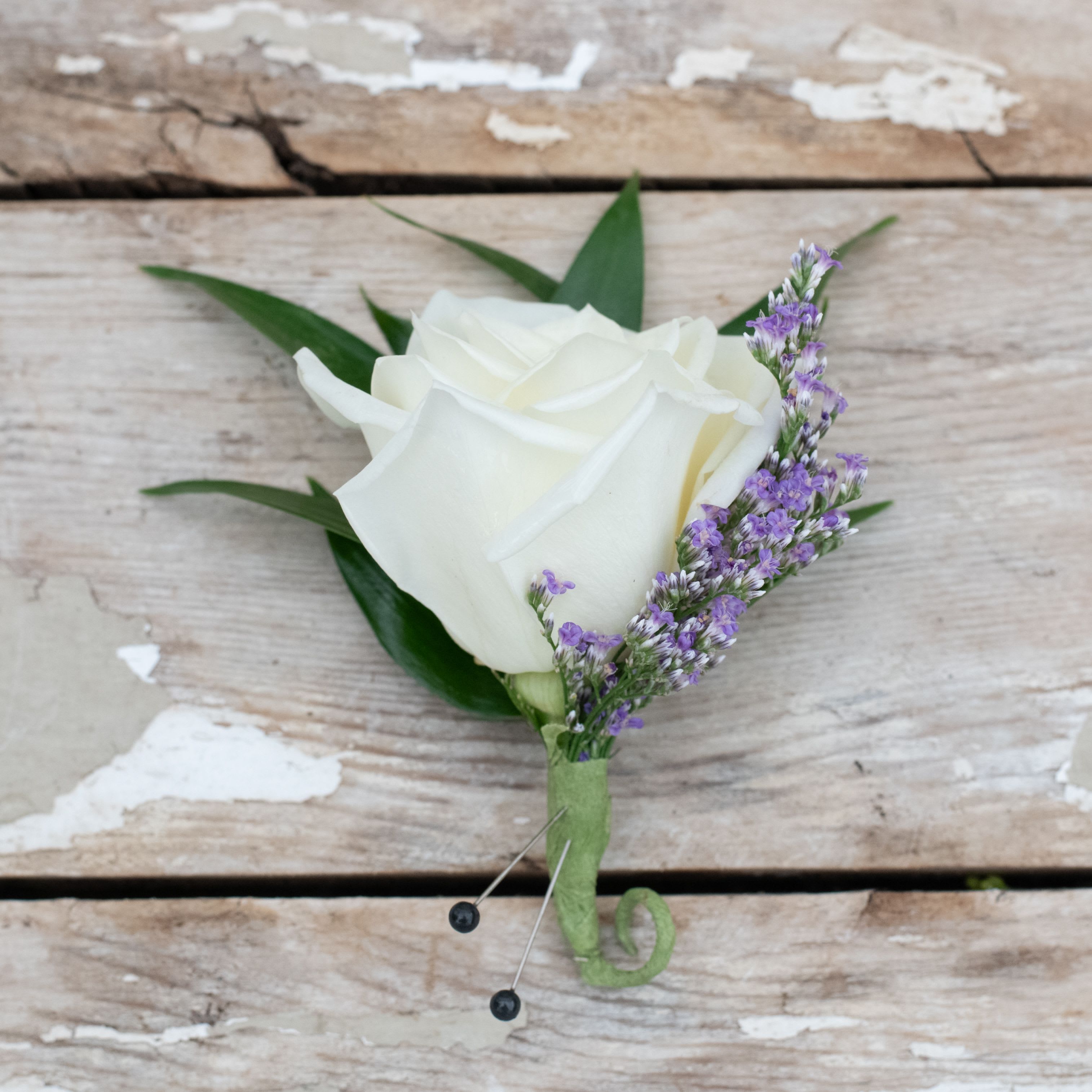 Classic Rose Prom Boutonniere - One rose in the color of your choice accented with greenery.