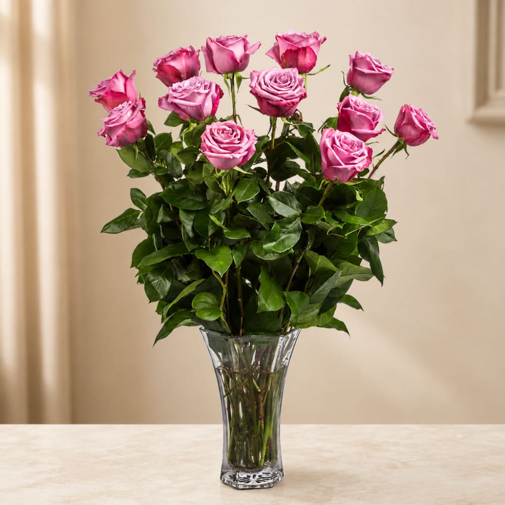Pink roses in a clear glass vase