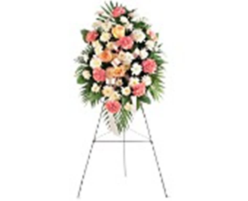Standing floral spray on an easel with pink and white flowers