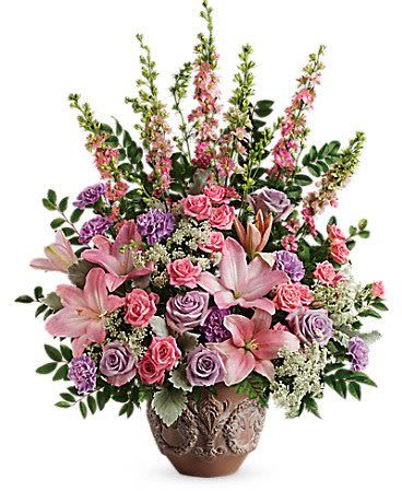Pink and lavender floral arrangement in a decorative vase