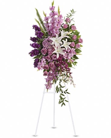 Tall purple and white floral spray on a stand