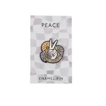 Enamel pin with a peace sign and flowers on a backing card