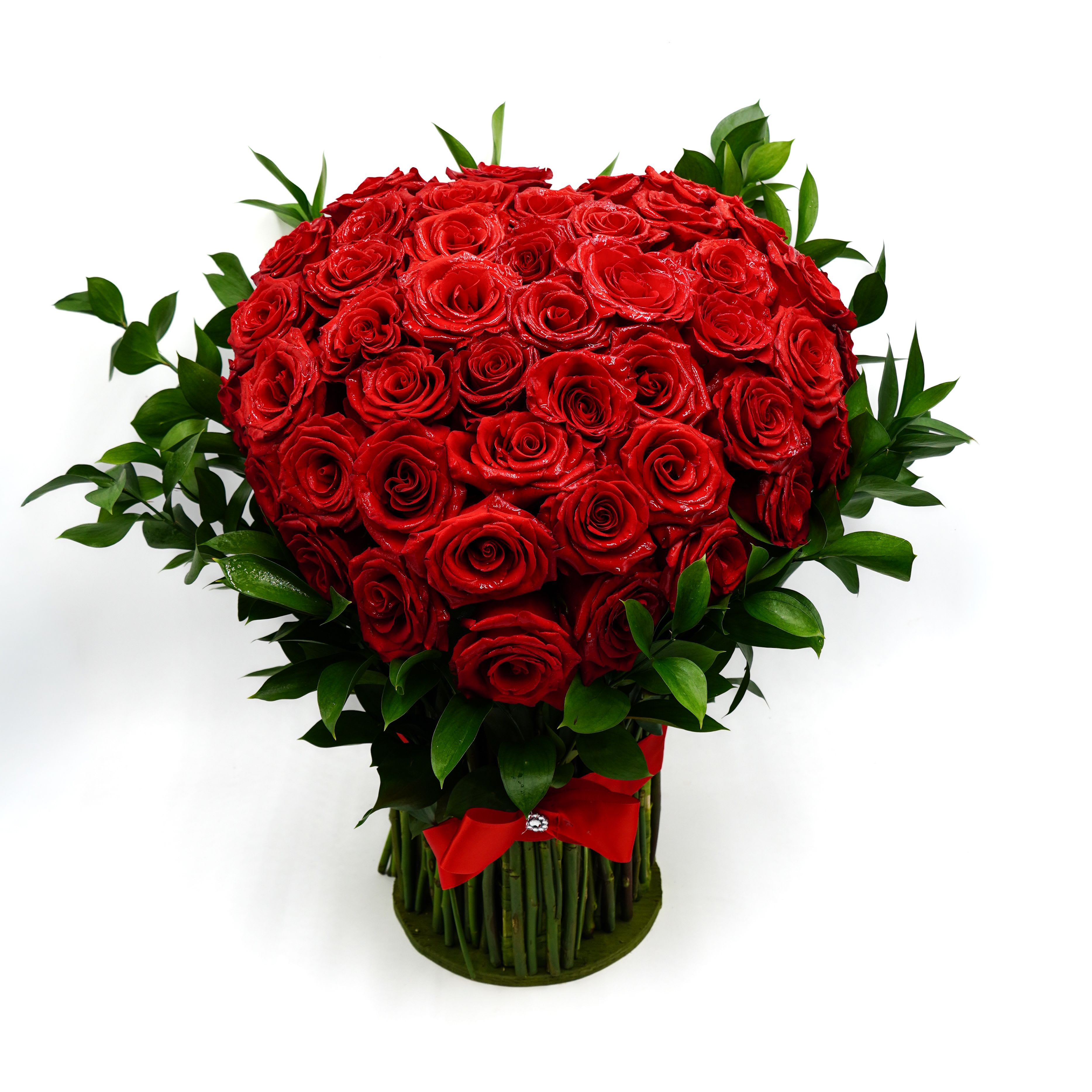 Standing Red Heart Bouquet by Atlanta's Finest Flowers  - A breathtaking display of luxurious red roses arranged in a full, heart-shaped design. Accented with fresh greenery and finished with a bold red ribbon, this elegant arrangement makes a powerful statement—perfect for anniversaries, Valentine’s Day, or any moment meant to be unforgettable.