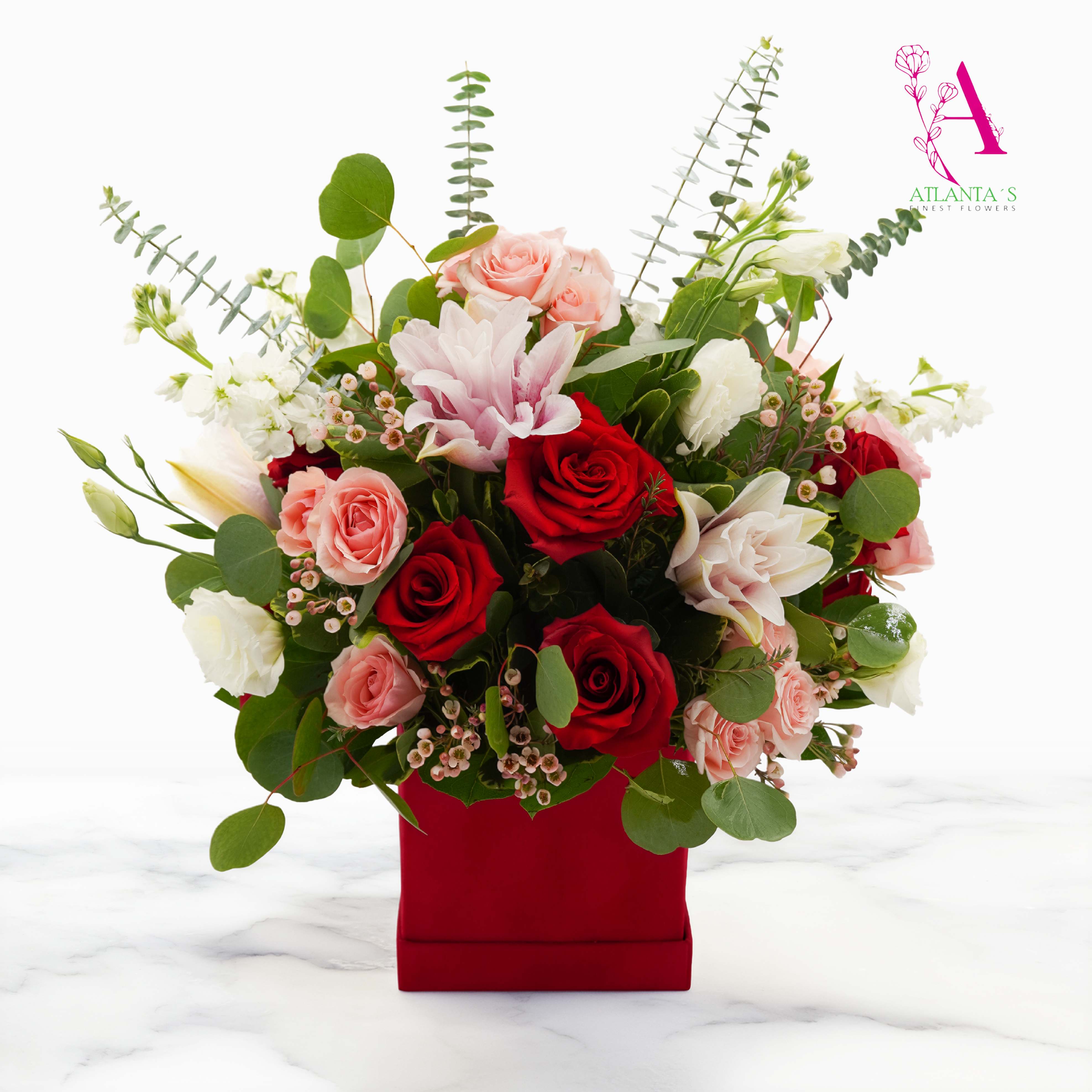 Mixed bouquet of red and pink roses in a red box