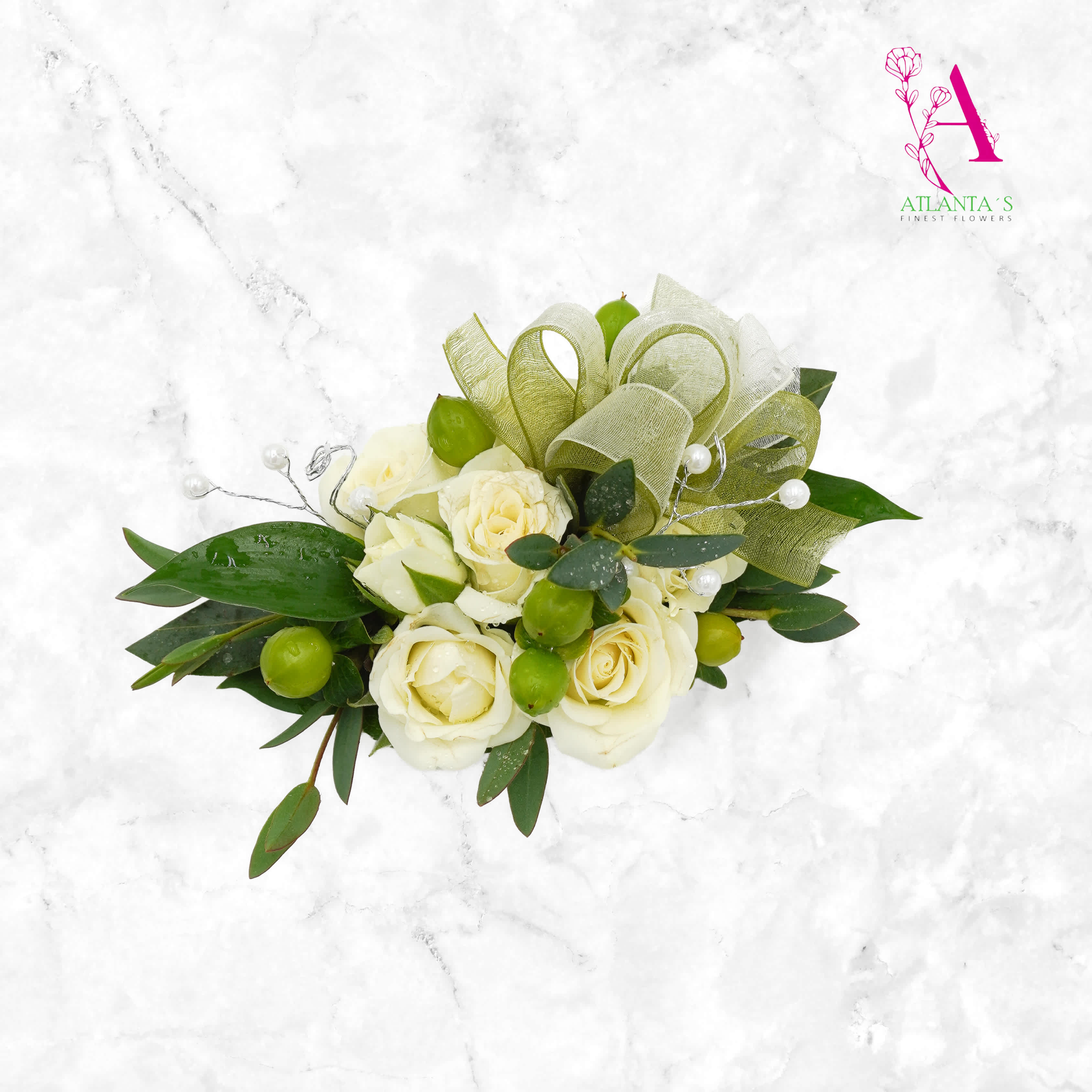White rose bouquet with green ribbon loops and pearl accents