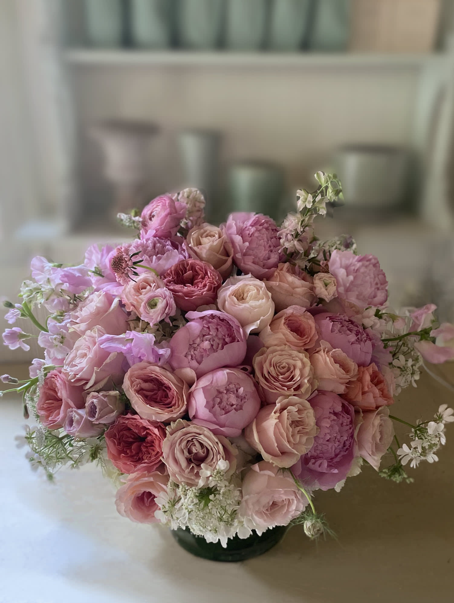 Pink and blush rose bouquet in a low vase