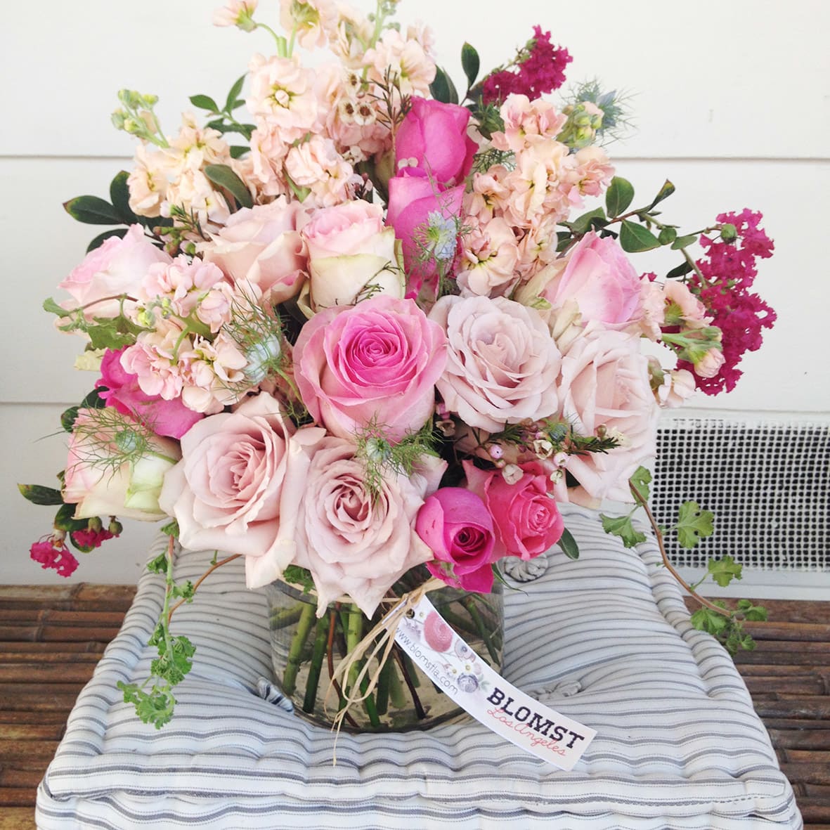 The Rose Powder - Gardenroses in pretty powder pastels accompanied by stock, geranium &amp; vax flowers. Arranged in a clear 5 by 7" vase. Natural arrangement for all occasions. Blomst LA only uses fresh, high quality flowers, all carefully selected every day to fit your flower order. We offer a personal hand delivery by our own delivery staff and guarantee the flowers will look perfect, when they arrive. We deliver in Glendale, Pasadena, Eagle Rock, Hollywood, Burbank, Beverly Hills - and everywhere else in Greater Los Angeles.