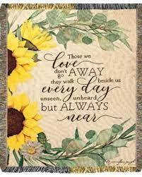 Sunflower-themed decorative blanket with a quote in the center