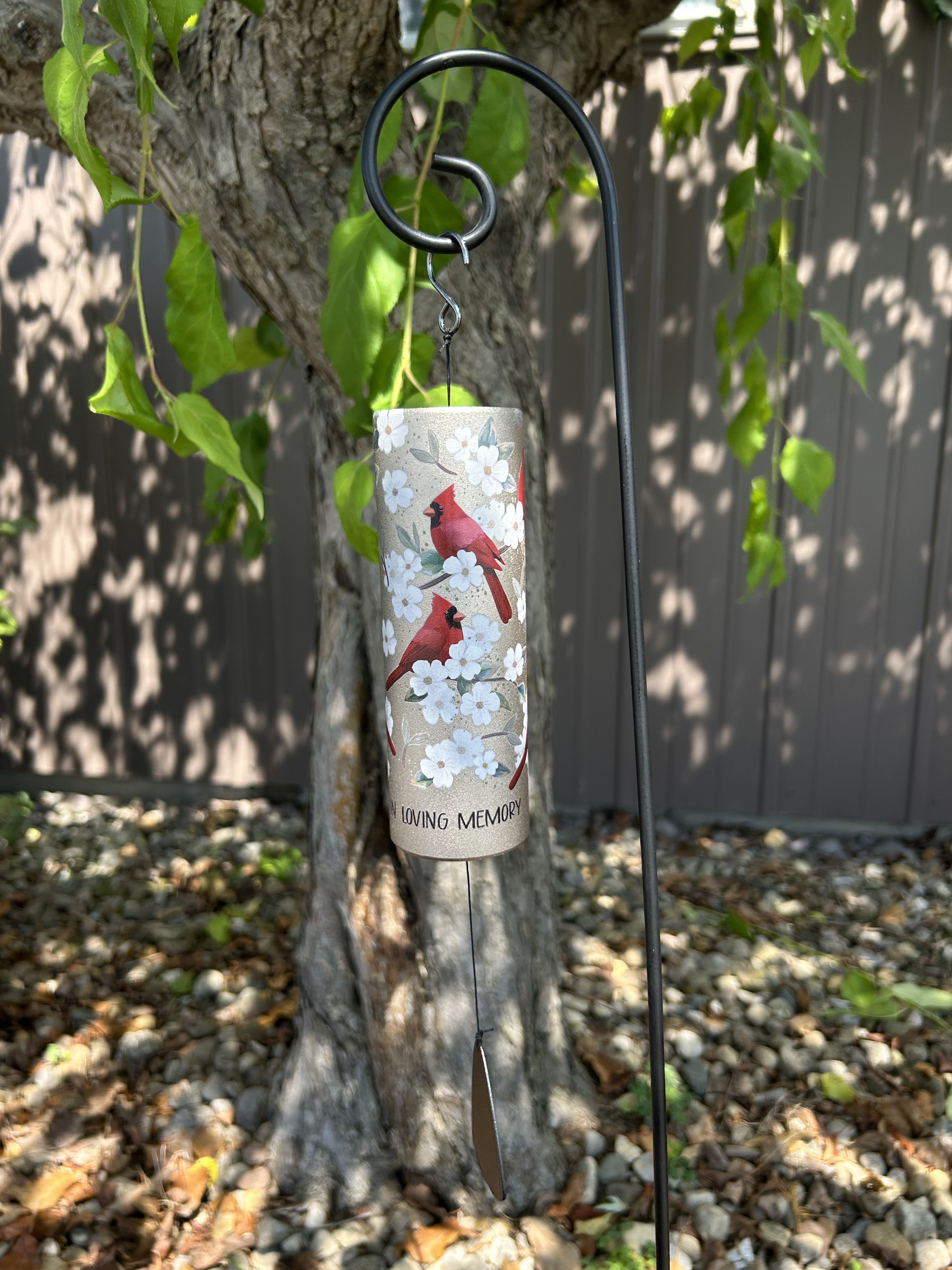 Cardinal memorial wind chime hanging outdoors