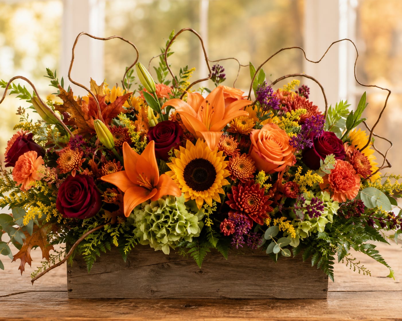 Autumn floral arrangement in a wooden box with lilies, roses, sunflowers, and mums