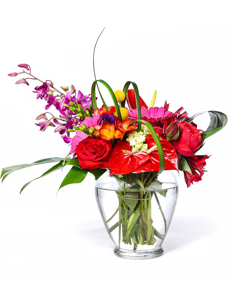 Colorful mixed bouquet in a clear glass vase