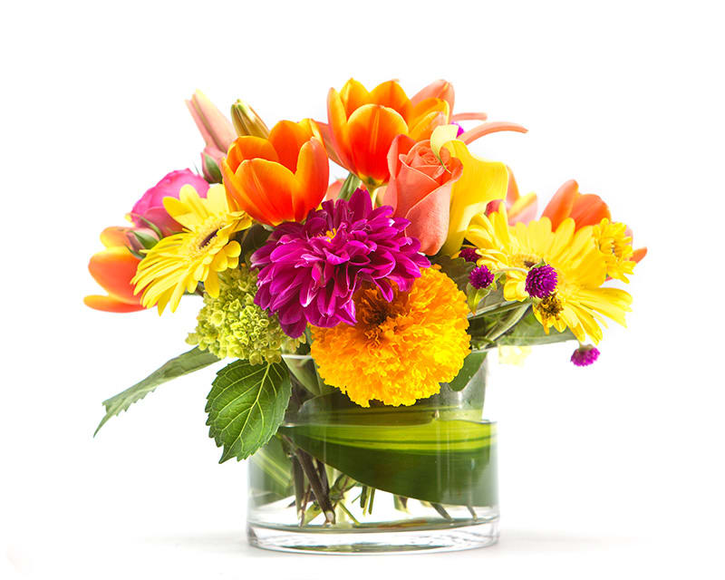 Bright mixed bouquet in a clear glass vase