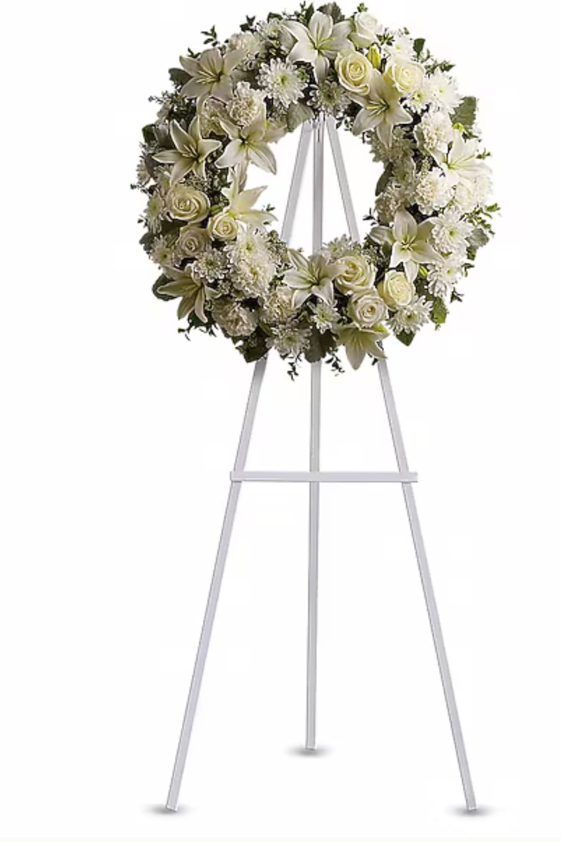 White floral wreath on a tall metal easel