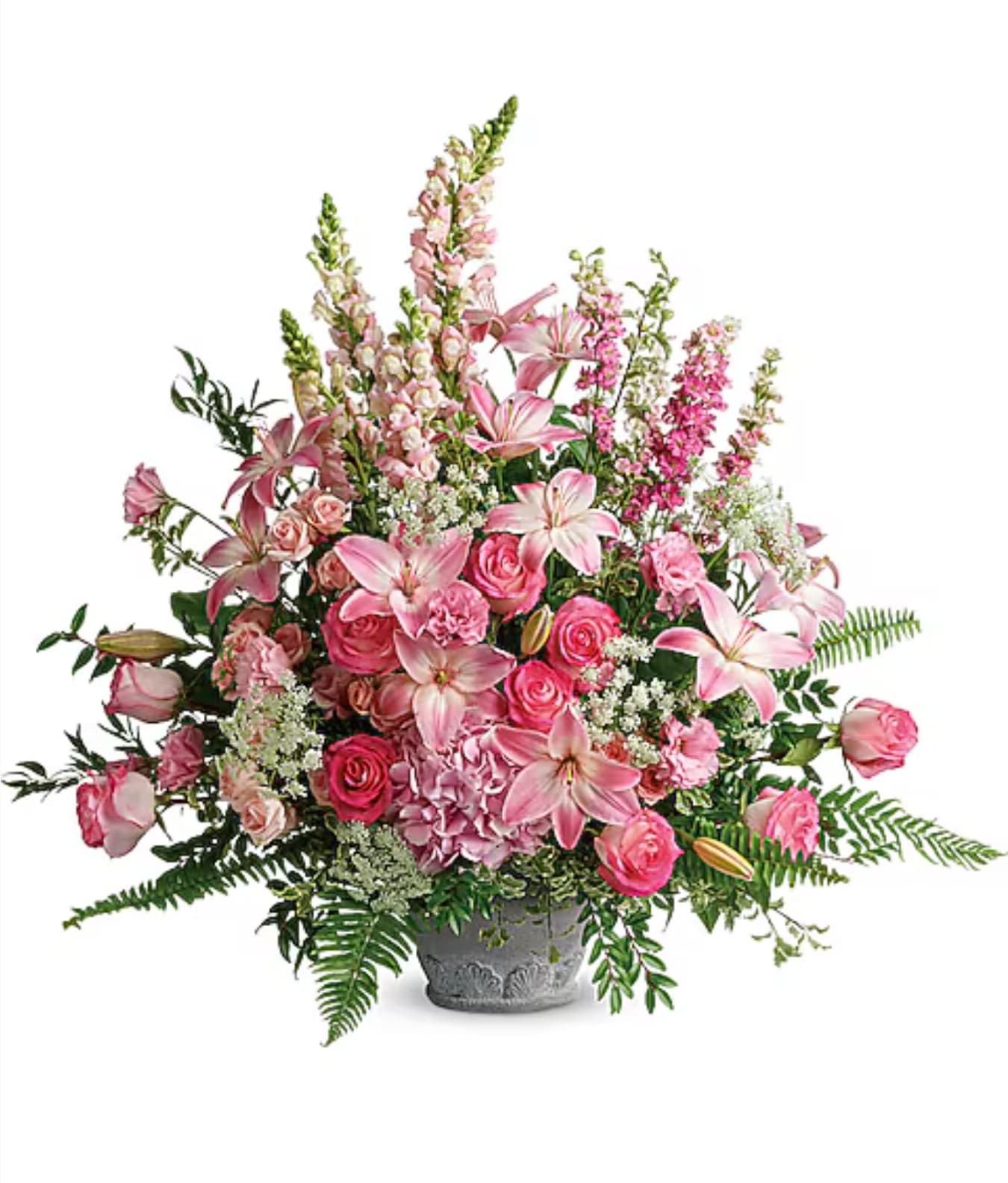 Pink lilies and roses arranged in a gray vase