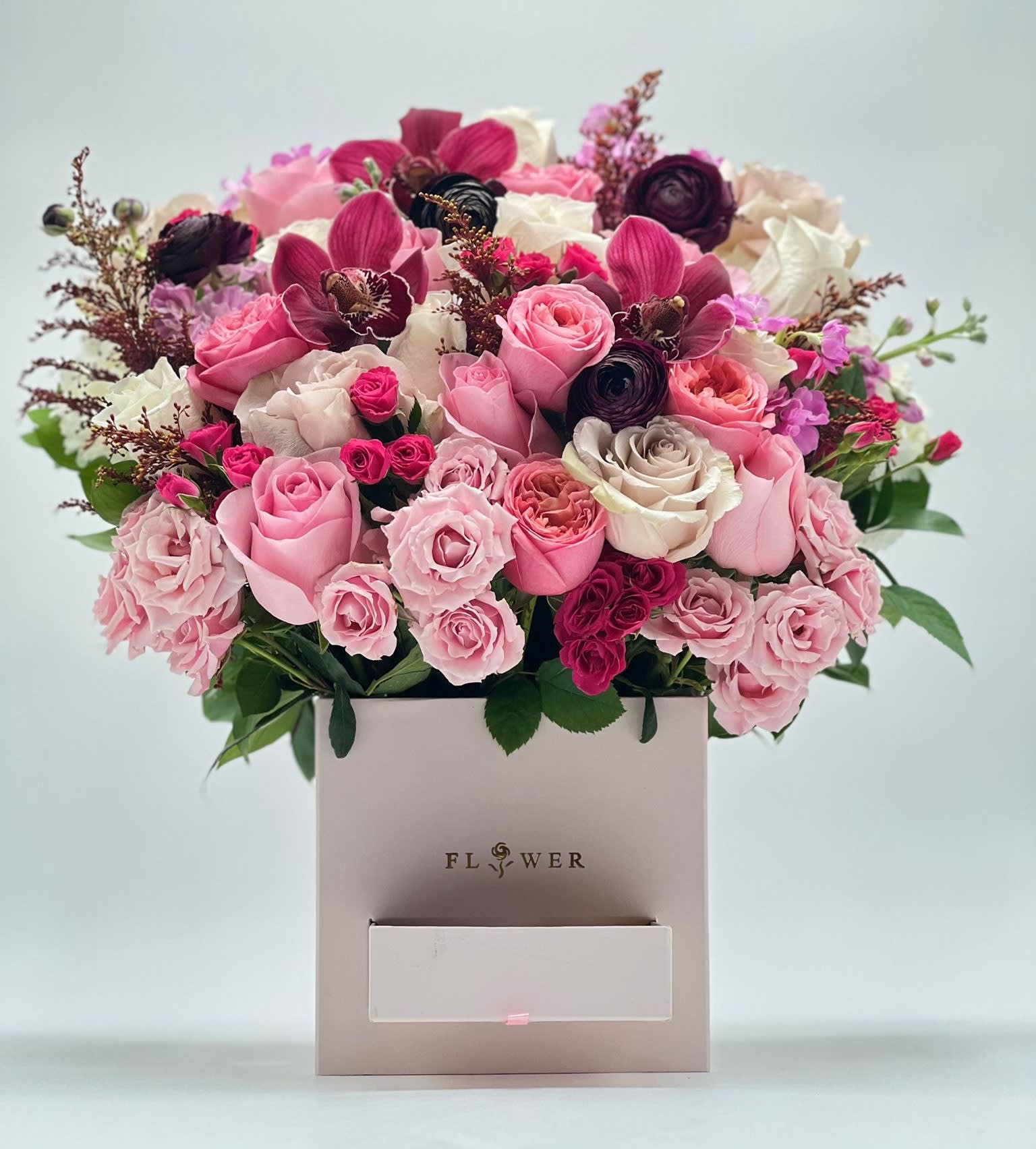 Pink and white rose bouquet in a square gift box