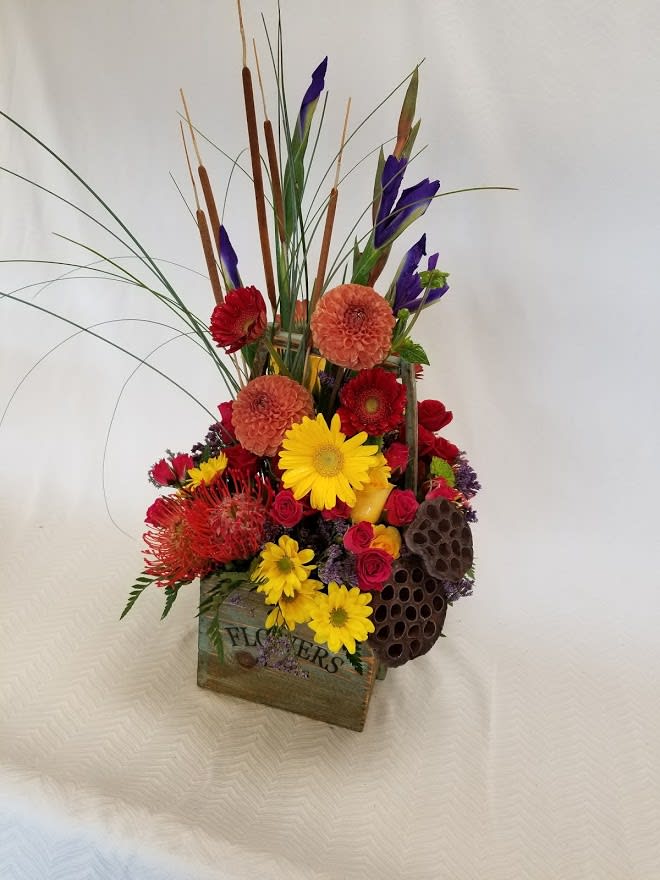Meadow Flower Box  - A wooden box full of what you might find in a meadow. Can be seasonally adjusted for your preferences. Flowers change with this box, we choose the freshest and seasonal flowers to place in your one of a kind box. 