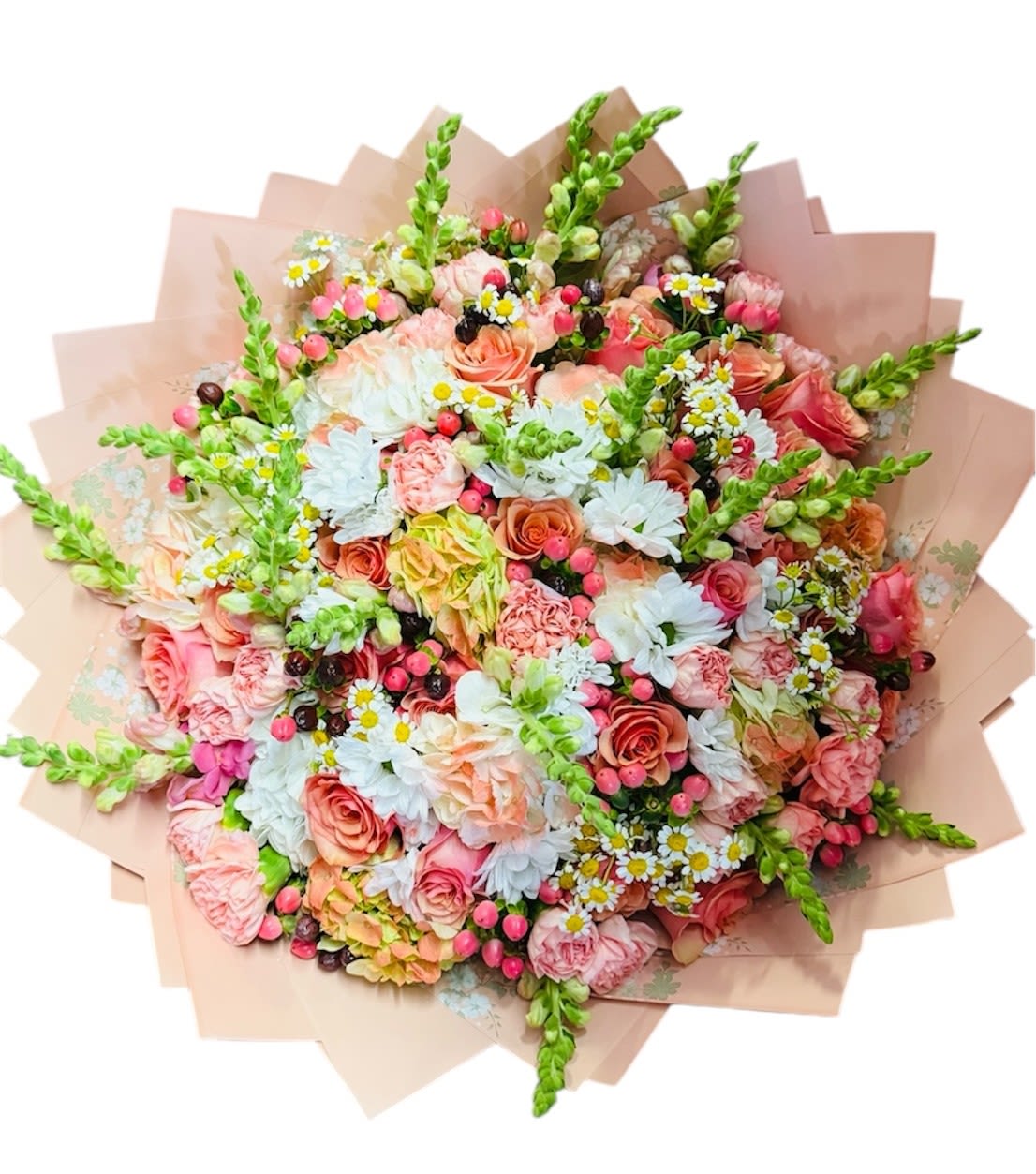 Large pastel bouquet of roses, daisies, and snapdragons wrapped in blush paper