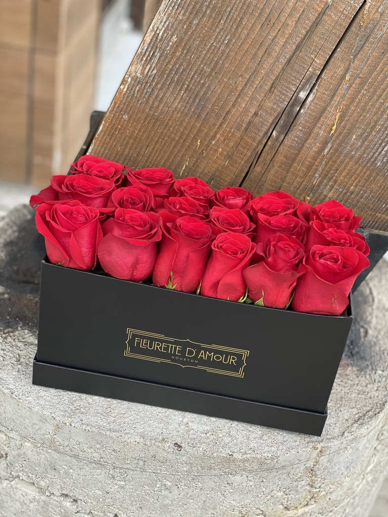 Box of red roses in a black gift box