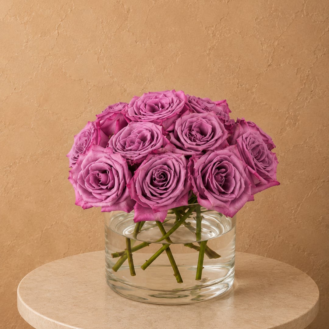 Pink roses arranged in a clear glass vase