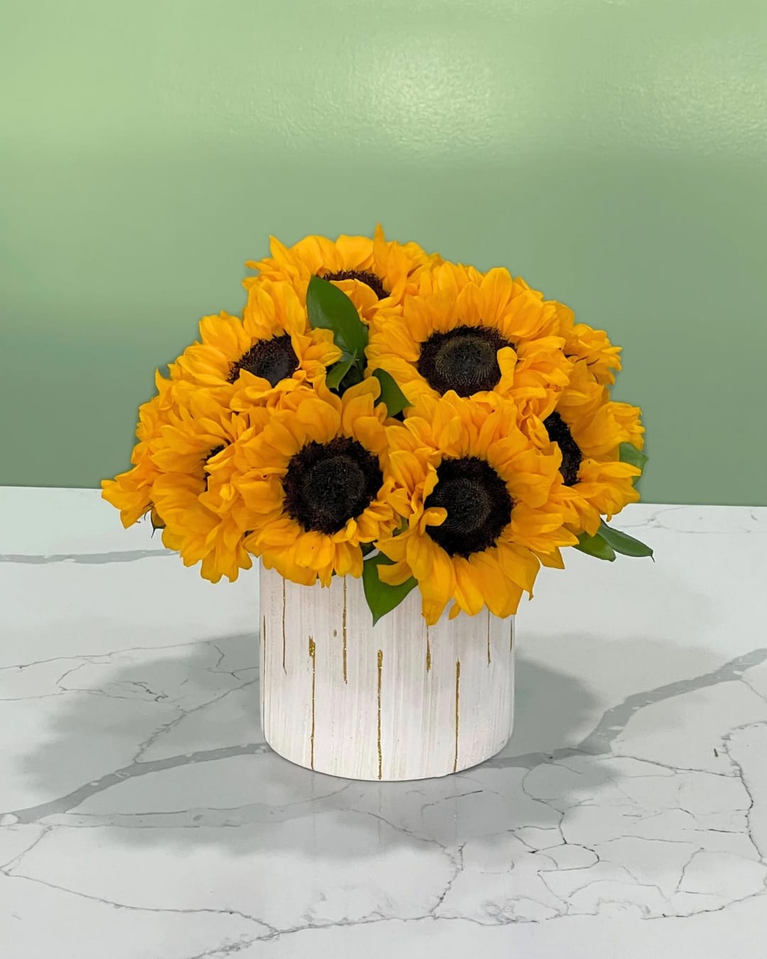 Harvest Gold - These radiant sunflowers capture the warmth of sunshine and the joy of togetherness, bringing endless summer days into your home.