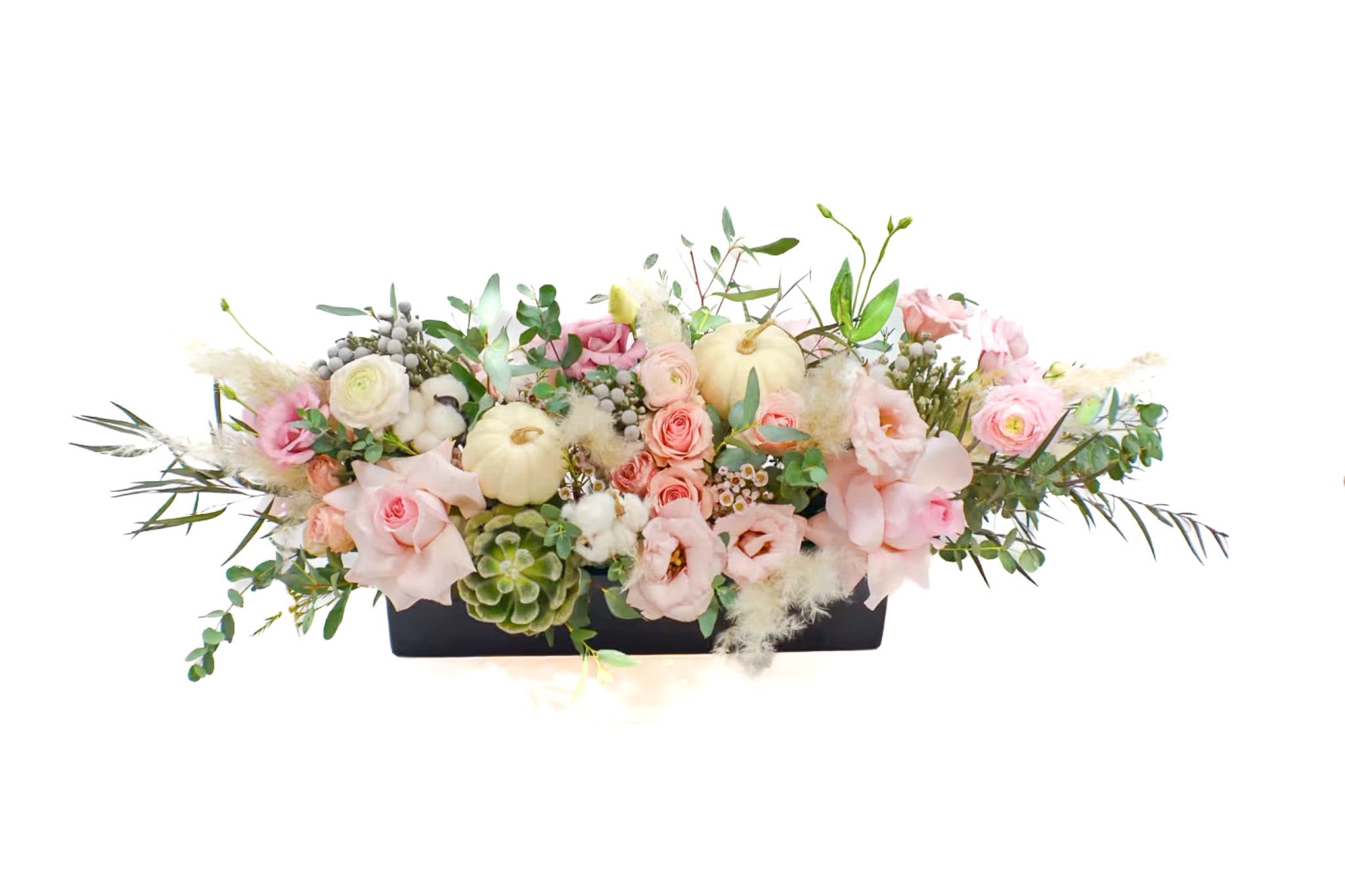 Low floral centerpiece with pink and white blooms in a black rectangular container