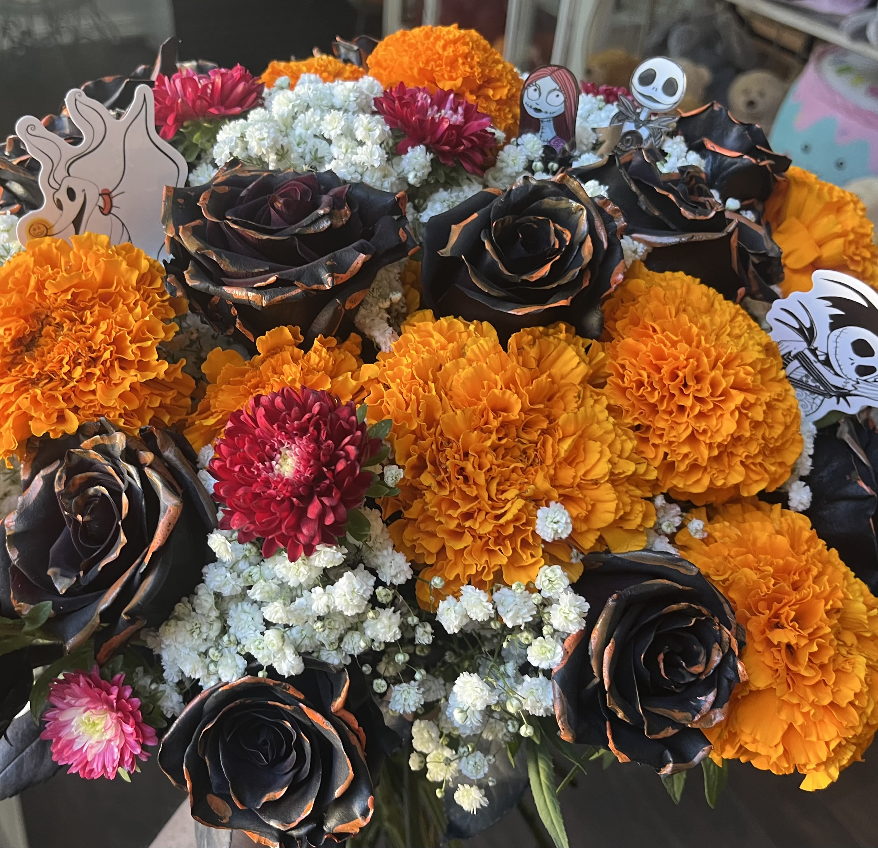 Nightmare before Christmas  - A dozen roses, marigolds, baby’s breath, and asters With nightmare before Christmas accessories