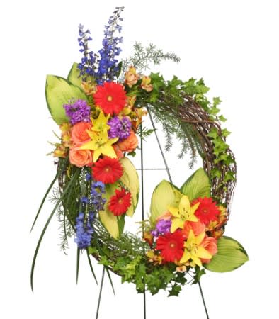 Colorful floral wreath with red, yellow, purple, and orange blooms