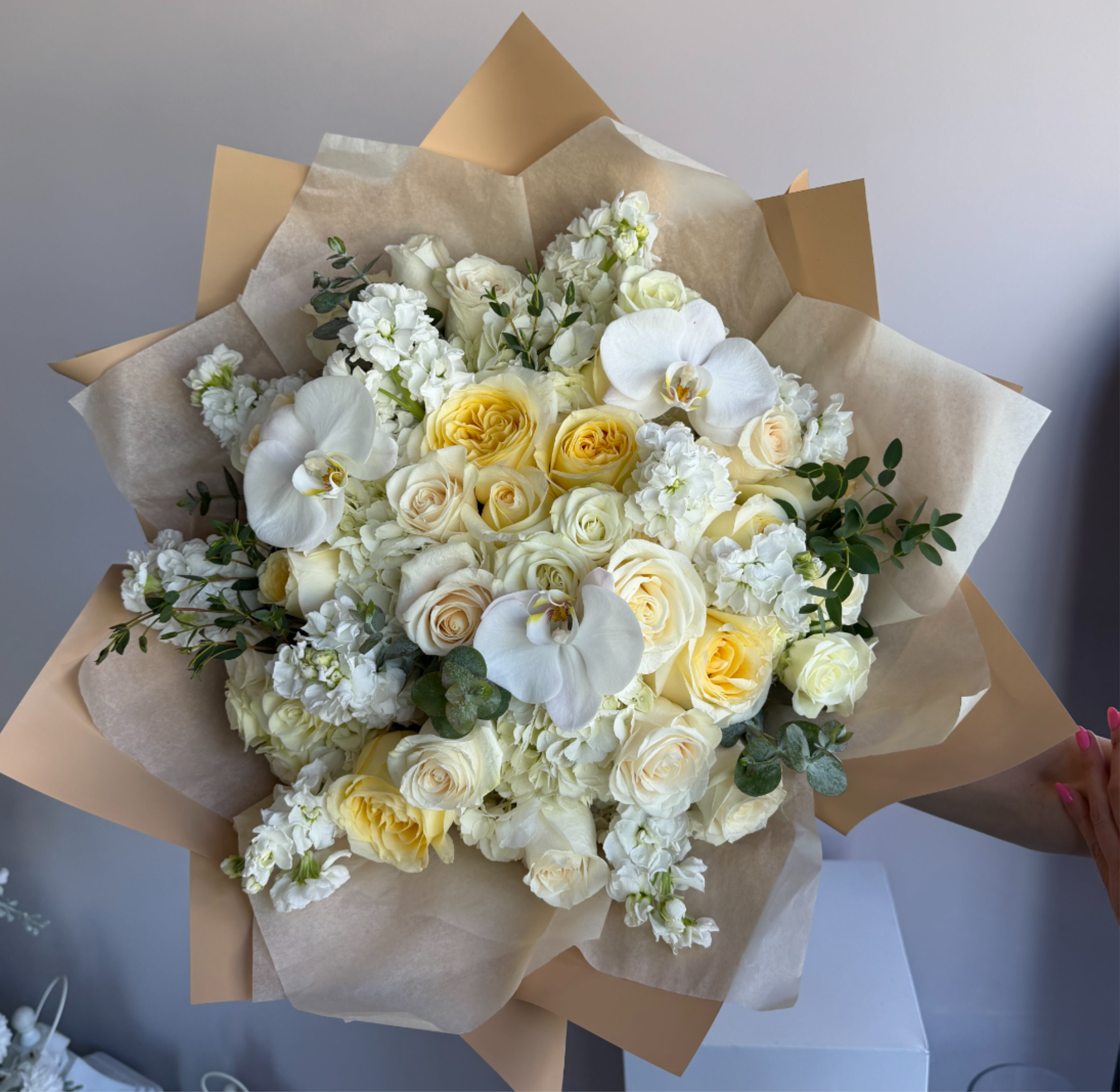 Pure D - This art is for those who love sophistication and uniqueness in everything. We associate white color with purity, kindness and peace, and this particular bouquet will be a great addition to the atmosphere of the house, reflecting peace and touching love. Seasonal or not available flowers can be replaced with a similar one. Boxes and baskets can also be replaced with others DELUXE size is shown in the main picture.