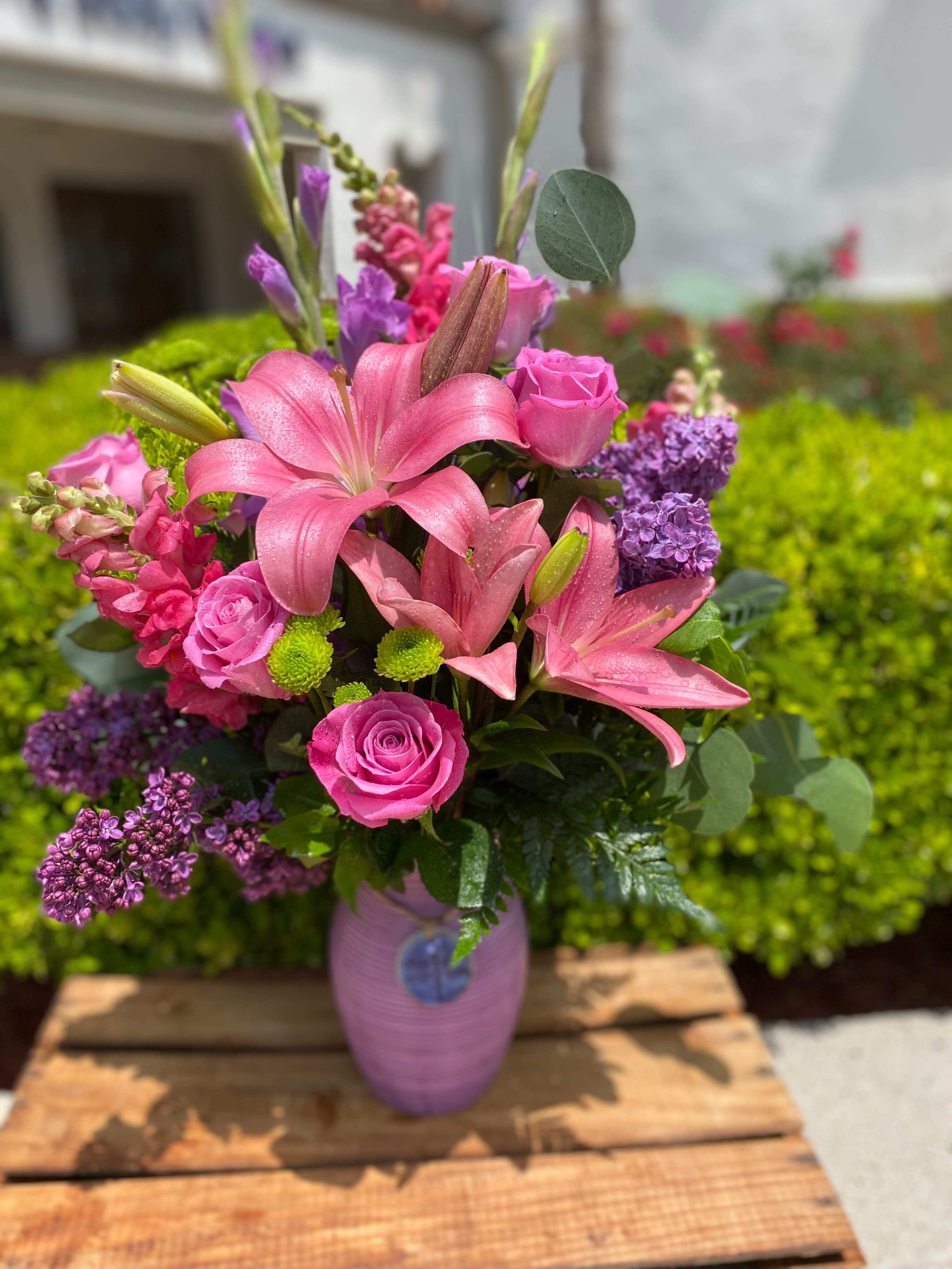Dragonfly  - The beautiful Dragonfly arrangement has Lily’s, Roses, Snapdragons, and stock