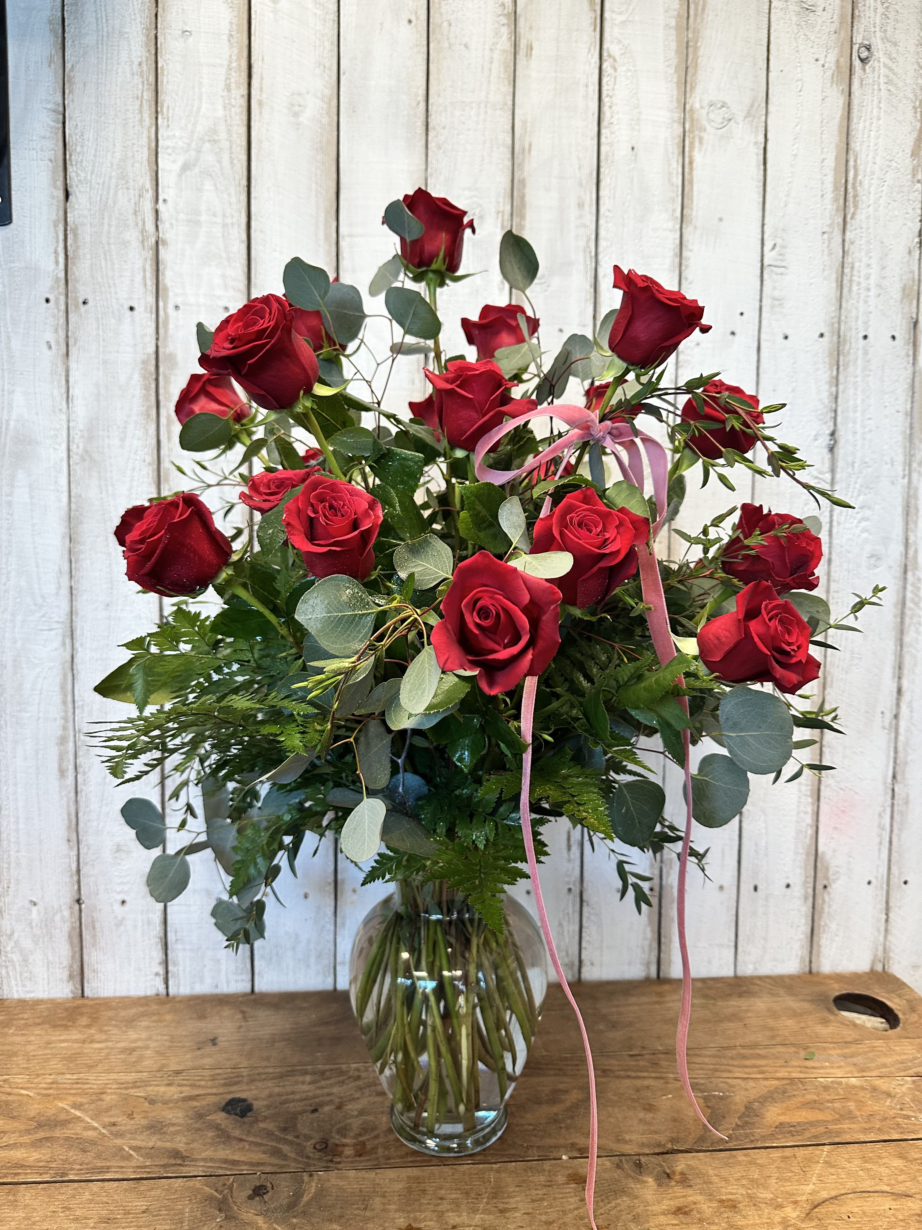 2 dozen Red rose - Make a grand and unforgettable statement with our 2 Dozen Premium Red Roses—the ultimate expression of love, romance, and admiration. Featuring 24 long-stem, hand-selected red roses, this stunning arrangement is designed with lush greenery and styled in a classic glass vase for an elegant, timeless look.  Perfect for anniversaries, romantic gestures, Valentine’s Day, or when only the best will do, this arrangement is crafted to impress and leave a lasting impression.  Each design is thoughtfully created by our expert floral team, giving it a full, luxurious feel with a modern garden-style touch. Looking for a custom color? This arrangement is also available in pink, yellow, white, or lavender roses—simply call us to personalize your order.  Available for same-day flower delivery in Rancho Cucamonga and throughout the Inland Empire, this premium rose arrangement is the perfect way to say I love you in the most beautiful way. 