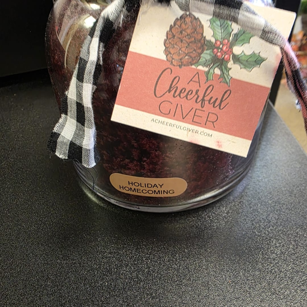 Holiday gift jar with plaid ribbon and a Cheerful Giver label