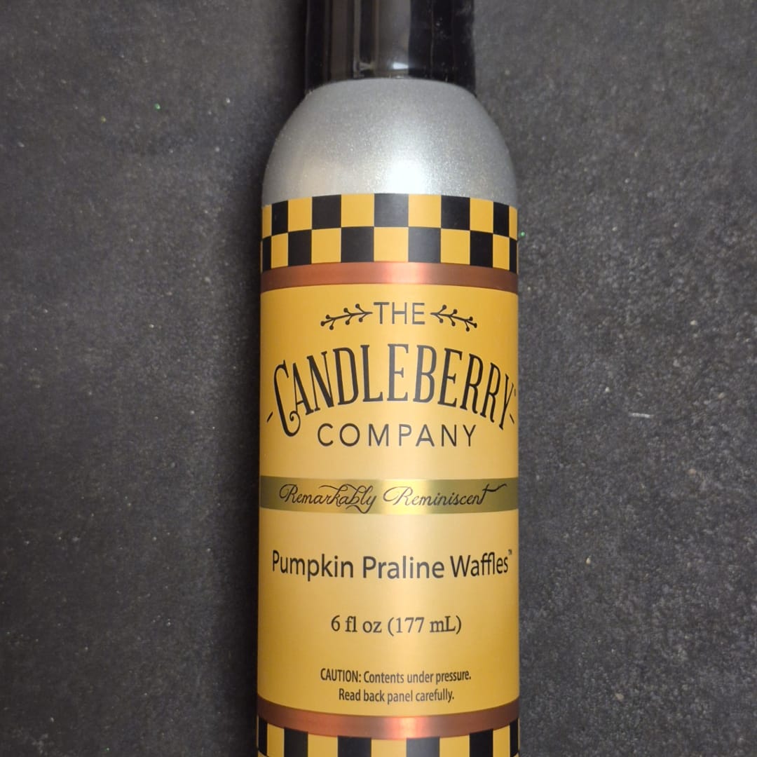 A pumpkin praline waffles candle in a silver spray bottle